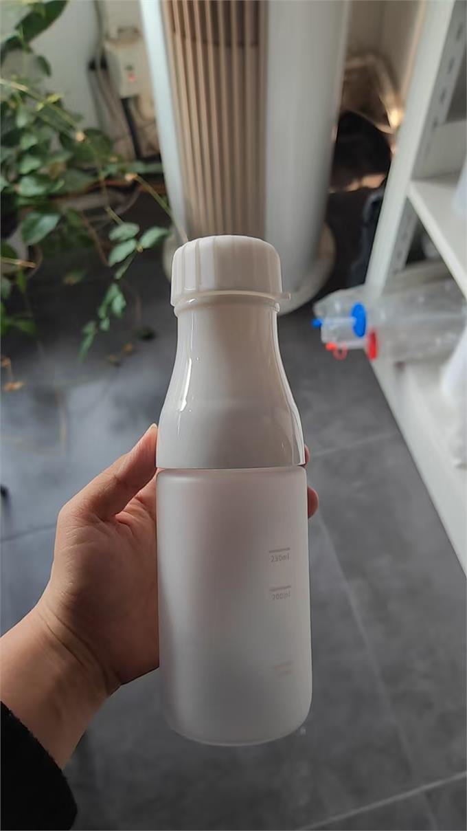 Frosted sports bottle with white body