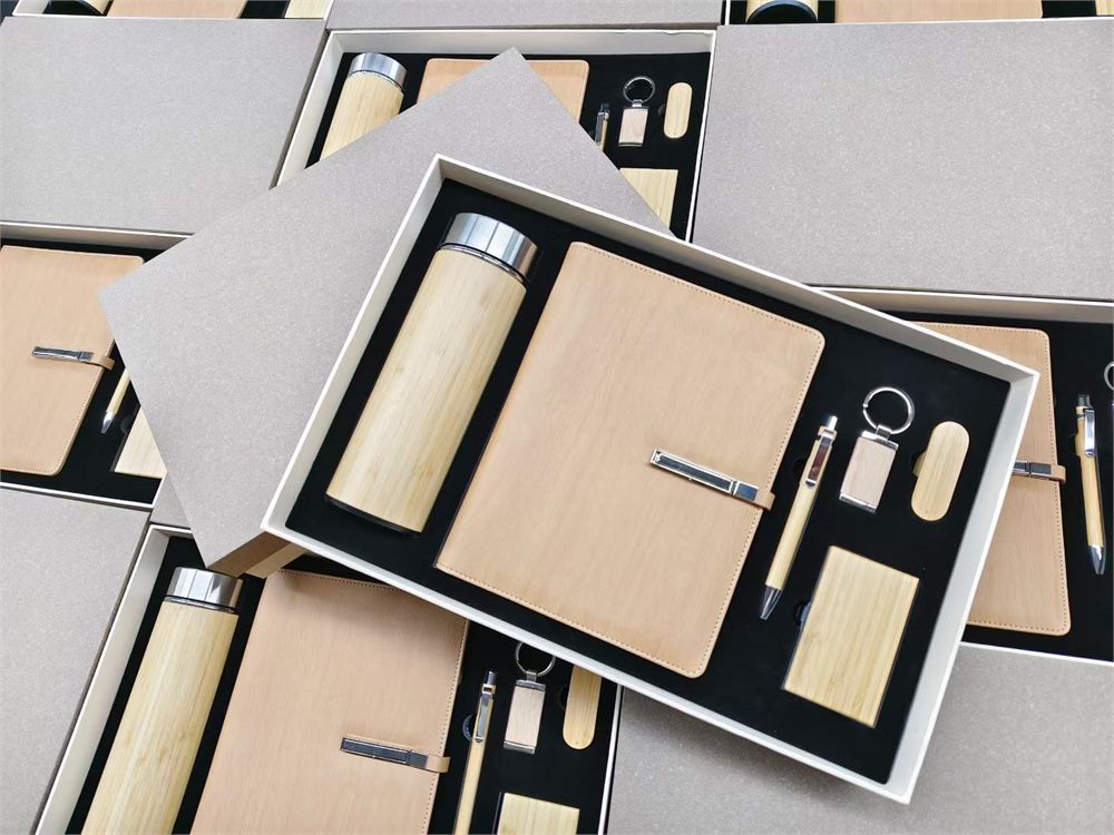 Bamboo corporate gift set with notebook bottle pen and matching accessories