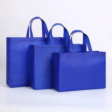 Blue reusable nonwoven tote bags in multiple sizes for custom logo programs